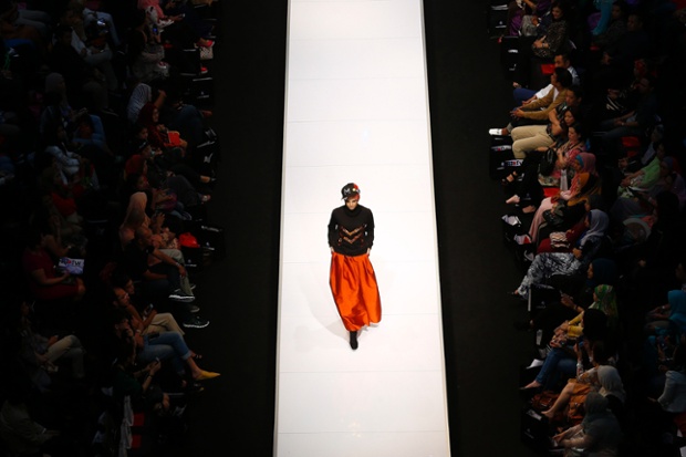 A model on the catwalk in a creation by Madeena during the Islamic Fashion Festival in Kuala Lumpur, Malaysia.