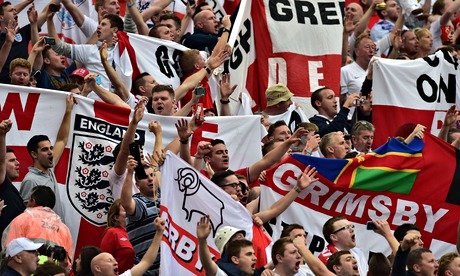 England football supporters cheer ahead of Thursday's defeat by Uruguay at the Corinthians Arena in 