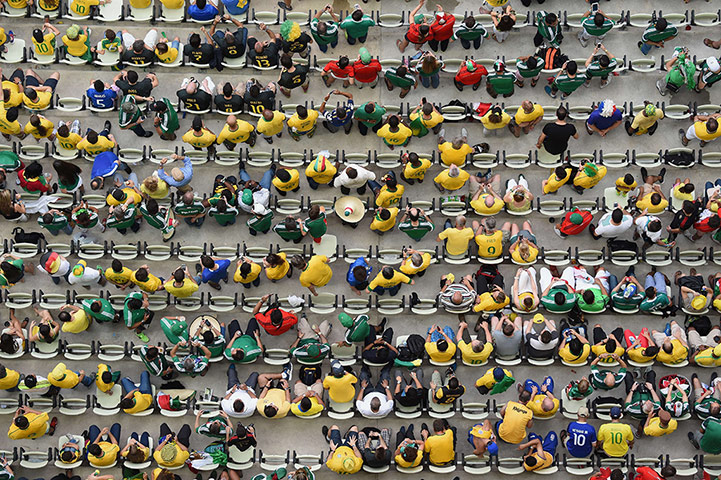 20 Photos: Football fans are seen during the match between Brazil and Mexico