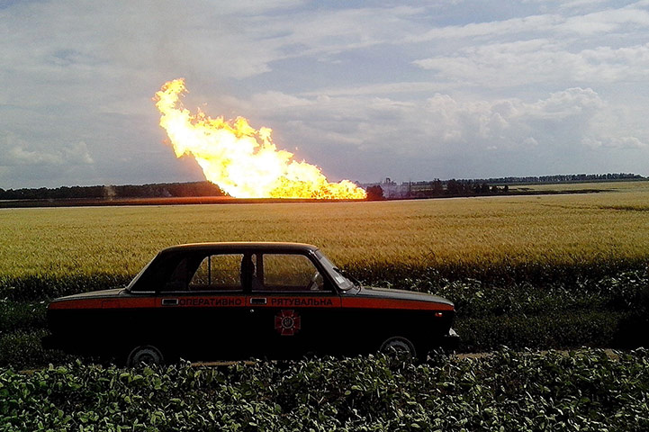 20 Photos: A police car in front of a fire caused by a blast in Iskivtsi