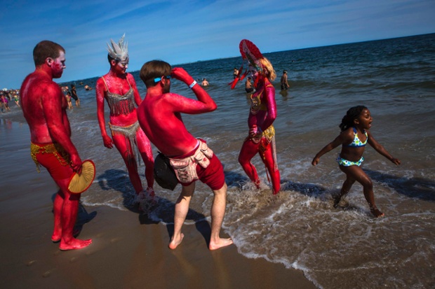 People take part in the Mermaid Parade at Coney Island, New York.