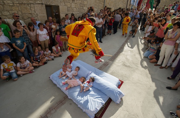 Baby jumping (El Colacho) is a traditional Spanish practice dating back to 1620 that takes place annually to celebrate the Catholic feast of Corpus Christi. Photograph: Denis Doyle / Getty Images