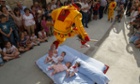 A man representing the devil leaps over babies during the festival of El Salto del Colacho (the devil's jump) in Castrillo de Murcia, Spain.