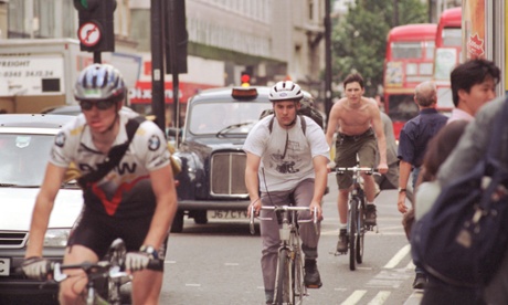 Cyclists traveling along Oxford Street in central London.