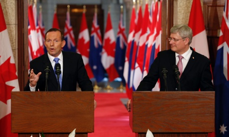 Canadian Prime Minister Stephen Harper (R) and his Australian counterpart Tony Abbott attend a joint press conference at Parliament Hill in Ottawa, Canada on June 9, 2014.