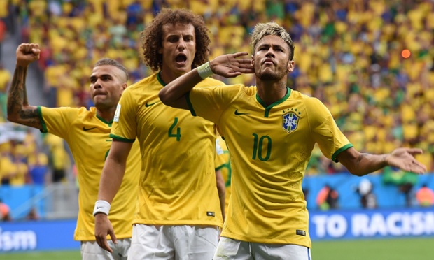 Brazil's forward Neymar celebrates after scoring against Cameroon.