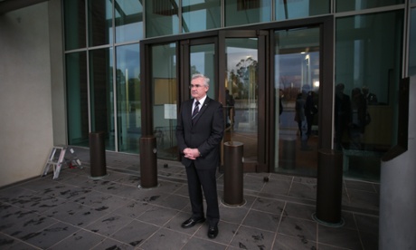 Independent MP Andrew Wilkie waits his turn to speak to the media at the ritual known as 