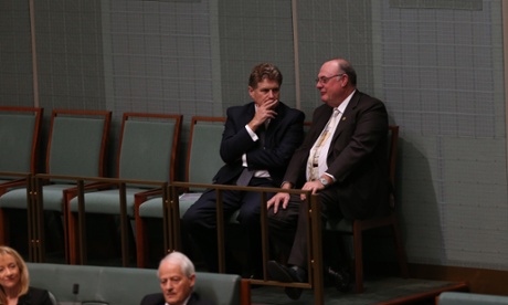 Leichhardt MP Warren Entsch talks with former member Peter McGauran during question time.