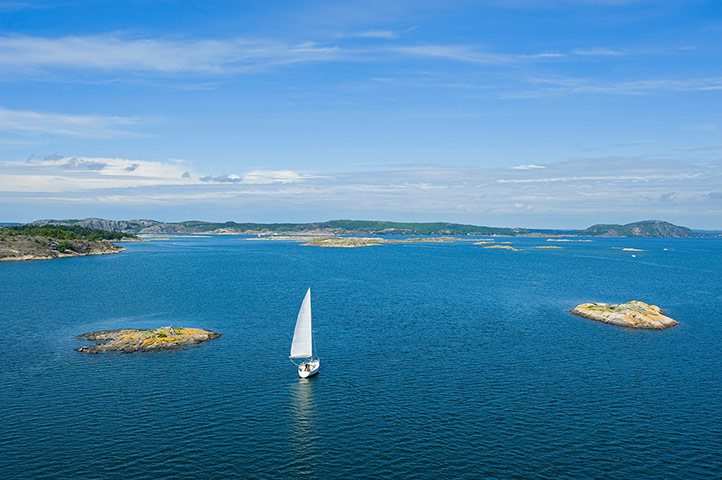 Visit west Sweden: Visit west Sweden: Fjord with sailing boat close to Marstrand