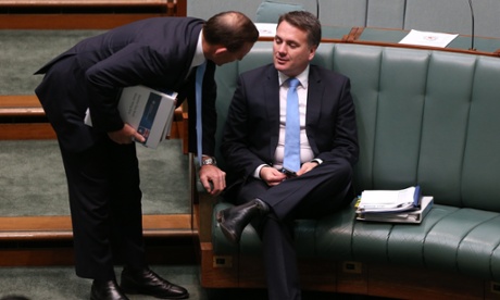 Tony Abbott talks with the Assistant Minister for Infrastructure and Regional Development Jamie Briggs before question time.