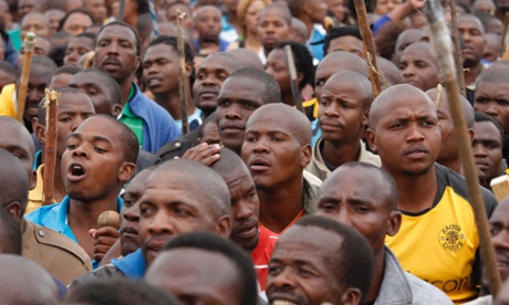 Some of the thousands of South Africa's striking miners from the Lonmin platinum mine marching to the gates of the Karee Mine to demand higher wages.