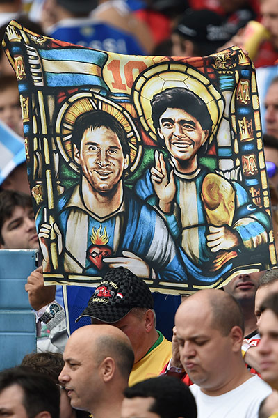 sport: An Argentina's fan holds an image of Arg