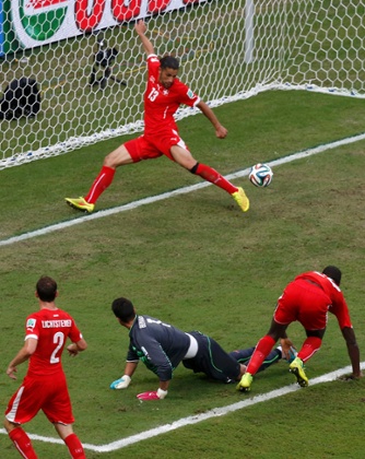 Switzerland's Ricardo Rodriguez clears the ball off the line.