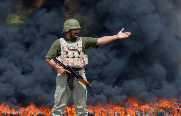 Seized drugs are burned during a ceremony to mark International Day against Drug Abuse and Illicit Trafficking on the outskirts of Peshawar, Pakistan.