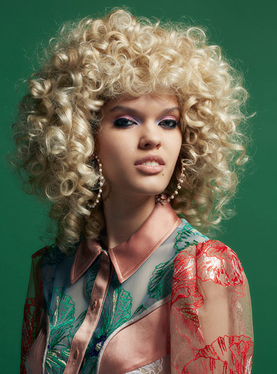 Fashion gallery: Patterned shirt and earings on model