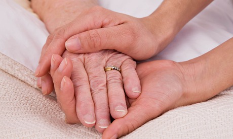 Woman holding olderwoman