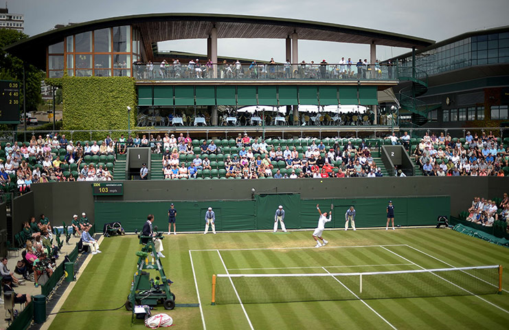 Wimbledon day four: Canada's Milos Raonic serves 