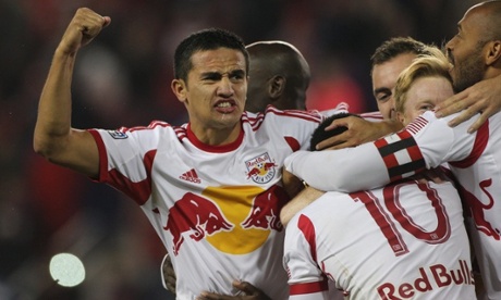 Tim Cahill celebrates with New York Red Bulls team-mates.