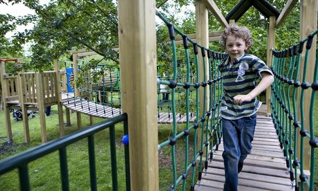 Child playing in the outdoor playground area at Hanbury Hall, Worcestershire