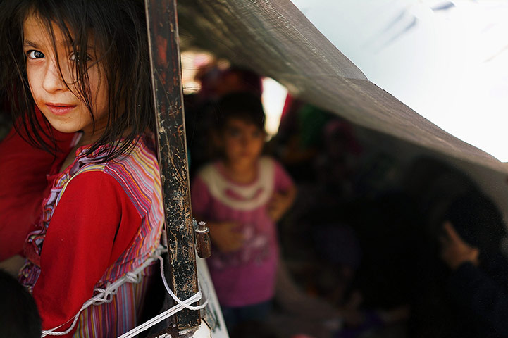 20 Photos: Refugees Fleeing ISIL Offensive Pour Into Kurdistan