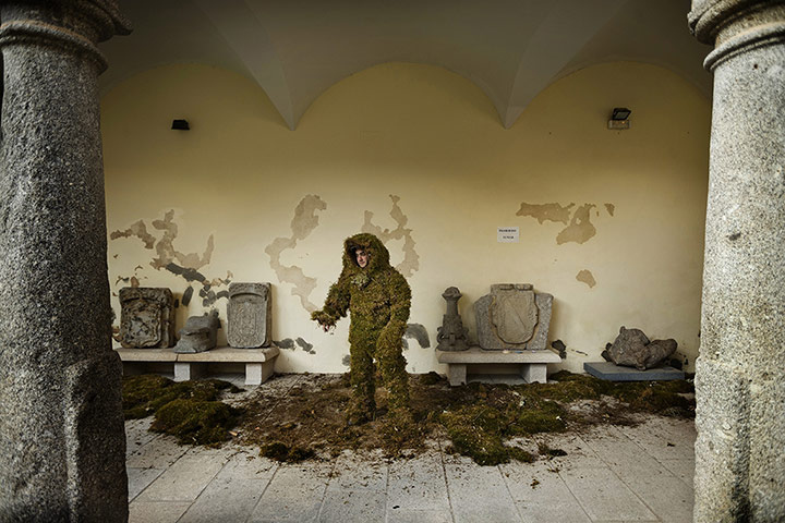 20 Photos: A man prepares for the Moss Men procession in Bejar, Spain