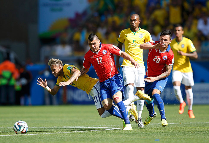 Brazil v Chile: Its a lively start as Neymar falls fighting for the ball with Medel
