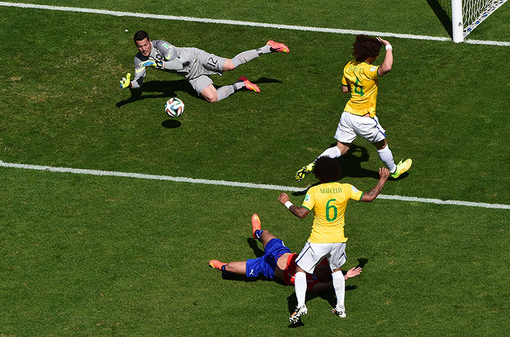 Brazil v Chile: Brazil's goalkeeper Julio Cesar grabs the ball from an inviting cross