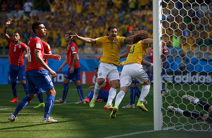 Brazil v Chile: Luiz celebrates with Fred after scoring the opening goal.