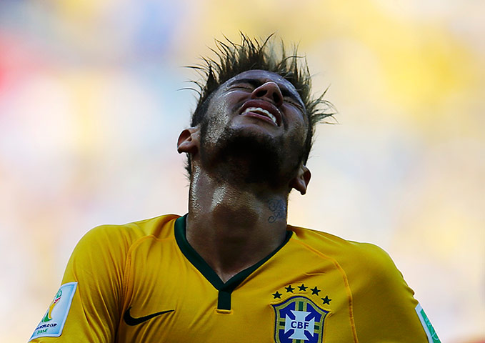 Brazil v Chile: Neymar looks in pain. 1-1 at half time.