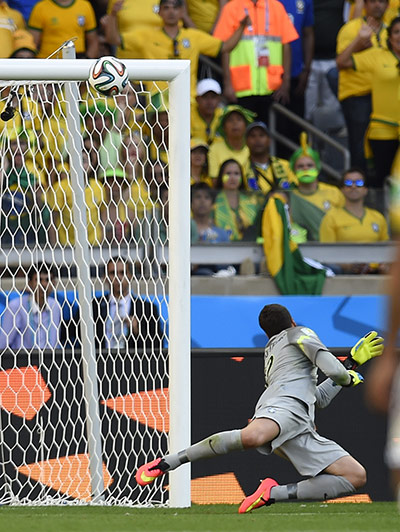 brazil v chile: Brazil's goalkeeper Julio Cesar looks at the ball hitting the bar