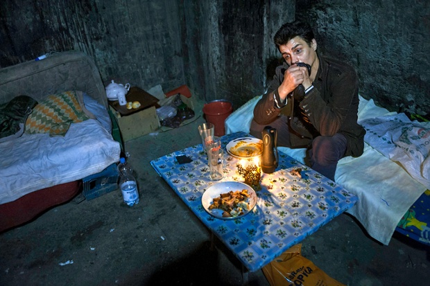 Hora Florin, aged 28, grew up in a Romanian orphanage, and now lives underground in a sewer in Buacharest where the heating vents keep him warm at night.