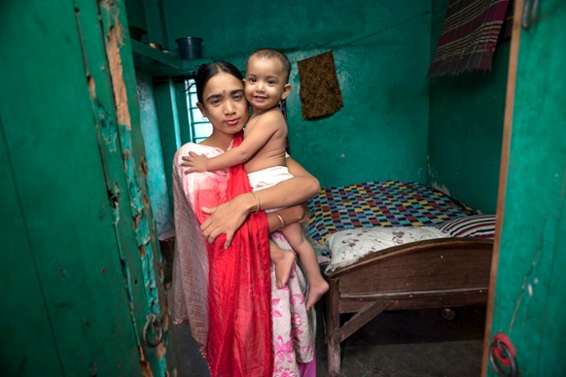Labone, aged 27, who works at a brothel in Jessore, Bangladesh with her daughter who was fathered by a client. All the money she earns is given to her madam.