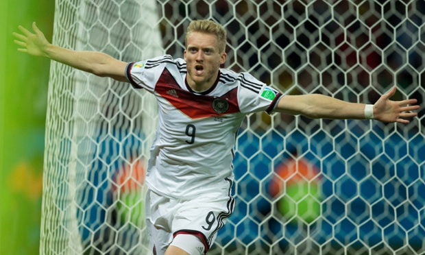 André Schürrle of Germany celebrates after scoring a goal during the first period of extra time against Algeria.