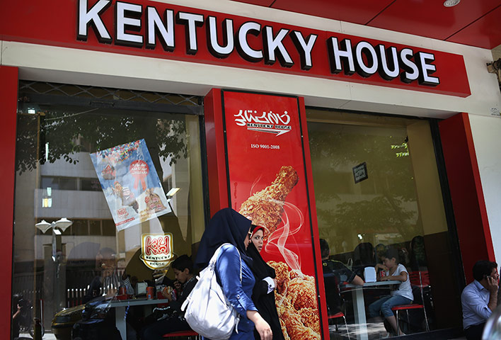 Agencies Iran Moore: women pass a fried chicken fast food restaurant in Isfahan