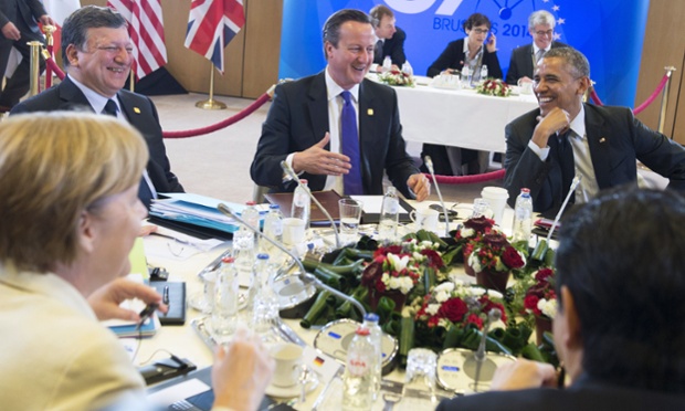 German Chancellor Angela Merkel, President of the European Commission Jose Manuel Barroso, British PM David Cameron, US President Barack Obama, and Japanese PM Shinzo Abe discuss the global economy during G7 in Brussels.