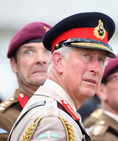 Look out: Prince Charles, and members of the Paras watch a parachute jump just outside Rainville during D-Day 70th anniversary Commemorations in Ranville, France. 