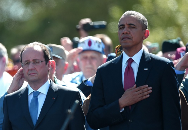 French President Francois Hollande (L) and US President Barack Obama (R) stand during a joint French-US D-Day commemoration ceremony at the Normandy American Cemetery and Memorial in Colleville-sur-mer, Normandy.