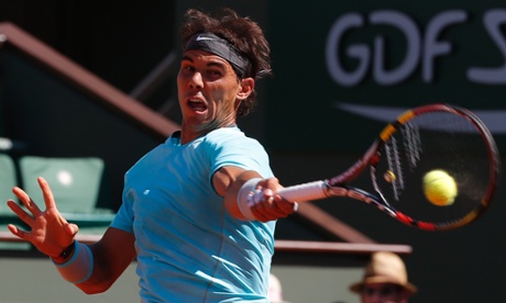 Rafael Nadal returns the ball to Andy Murray.