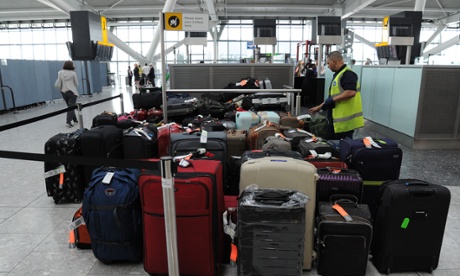 Luggage piles up at Heathrow Airport Terminal Five after the baggage system breaks down.