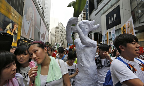 Protesters march for greater democracy from China during an annual protest in Hong Kong, 1 July 2014