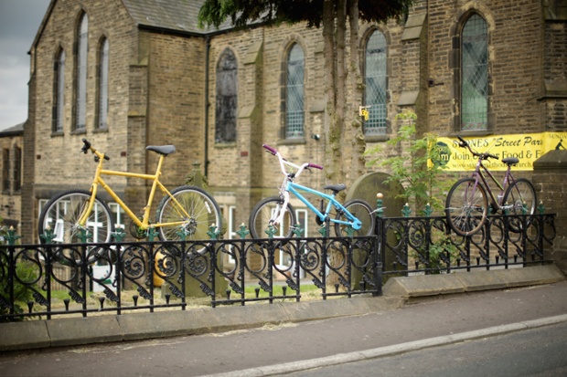 Stones Methodist Church decorates it's fence with cycles on the route of two in Sowerby Bridge.