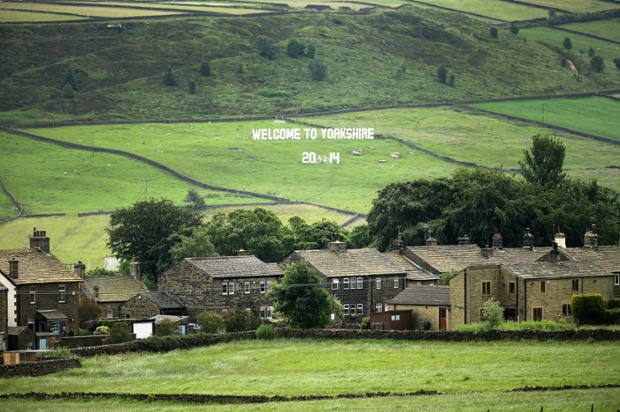 A giant 'Welcome to Yorkshire' sign adorns the dales near Haworth