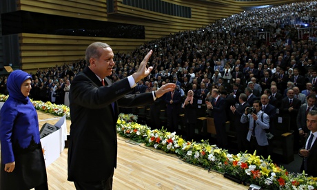 Turkish PM Recep Tayyip Erdoğan and wife Emine wave to party members at his presidential nomination