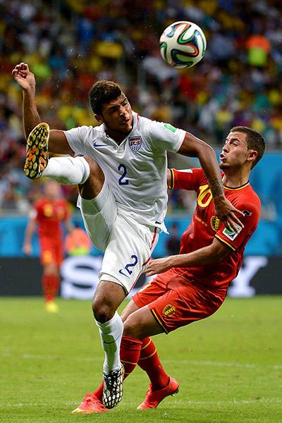 belgium v usa: DeAndre Yedlin clears whilst under pressure from Eden Hazard 