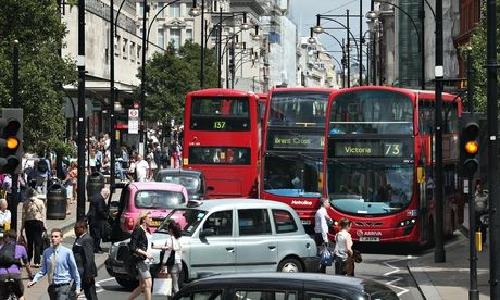 Cabs and buses in Oxford Street, London