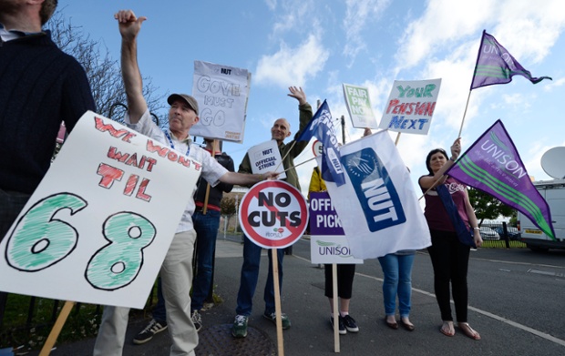 Public sector workers outside Charles Thorpe Comprehensive school in Ryton, Gateshead, as they take part in the one-day walkout as part of bitter disputes over pay, pensions, jobs and spending cuts.