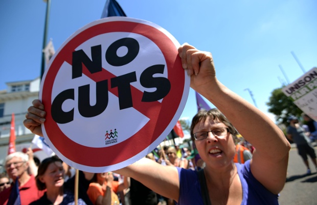 Public sector workers make their way to the Bournemouth International Centre, Bournemouth, where the Local Government Association's annual conference is taking place.