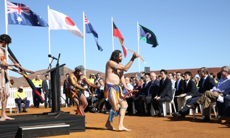Tony Abbott and Japanese Prime Minister Shinzo Abe watch traditional dancers at a Pilbara iron ore mine.