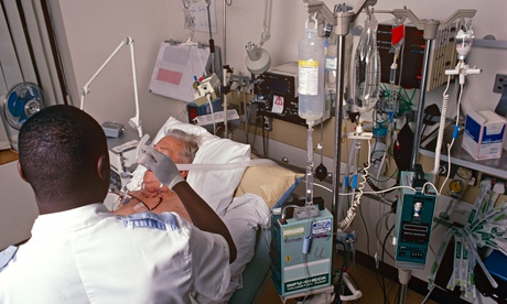 A male staff nurse with a patient