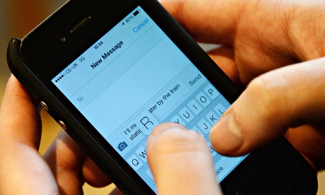 A person writing a text on a mobile phone